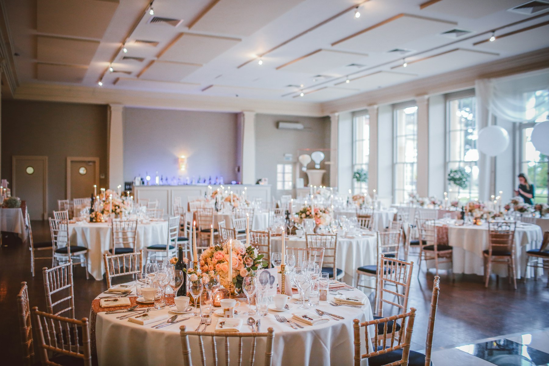 Reception tables with floral centerpieces